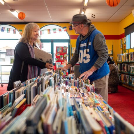 Roslyn Library interior with people browsing the picture books