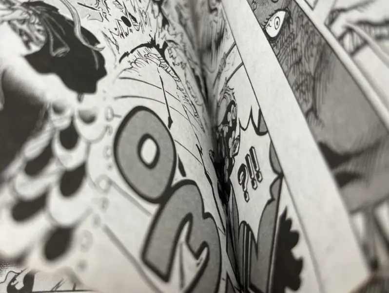 Close-up of two pages of black and white illustration